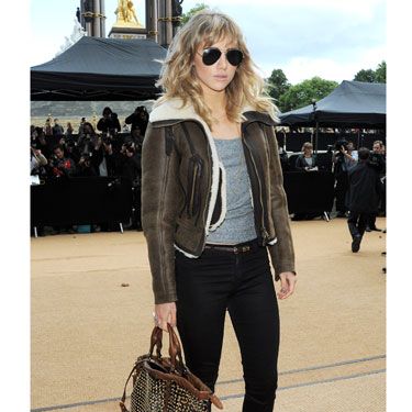 Suki Waterhouse's laid-back cool was epitomised with her shearline coat, grey vest and skinnies as she arrived at Kensington Gardens. Loving her studded bag, too. 
