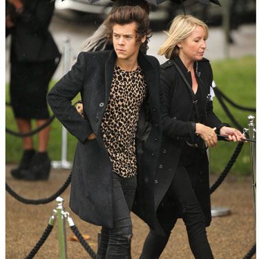 One Direction's Harry Styles had no shame about his leopard print t-shirt as he arrived at the show, wearing his famous curls in a bit of a huge quiff.