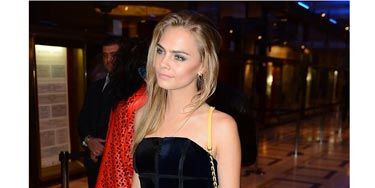 <p><a href="http://www.cosmopolitan.co.uk/fashion/news/cara-delevingne-london-fashion-week-style-so-far" target="_blank">Cara</a> was out and about last night in Milan sporting a more feminine look than we're used to seeing, wearing a midnight blue structured strapless mini-dress with red peeptoe heels. Her long hair was worn down and parted to the sign, giving her a softer feminine look. We love. </p>