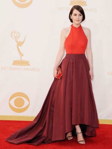 <p>Downton Abbey's Michelle went two-tone with her red dress with a bright halter neck and wine skirt that clashed perfectly. She stopped the dress from swamping her with endless material by having an asymmetric hem that showed off her shoes – nice trick!<br /><br /></p>