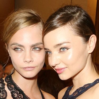 <p>Joining fellow famous model Miranda Kerr, Cara represented the feminine/masculine trend beautifully at Stella McCartney's show during Paris Fashion Week. With preppy partings and tight low ponytails, the hair had an air of androgyny while makeup featured graphic eyeliner for a modern 60s effect.</p>