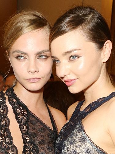 <p>Joining fellow famous model Miranda Kerr, Cara represented the feminine/masculine trend beautifully at Stella McCartney's show during Paris Fashion Week. With preppy partings and tight low ponytails, the hair had an air of androgyny while makeup featured graphic eyeliner for a modern 60s effect.</p>