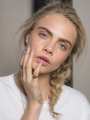 <p><strong>The look:</strong> Raw and minimal (except for blinging Swarovski crystal-studded nail art created by Marian Newman), the trend was for "nineties supermodel with no makeup on" according to makeup artist Lucia Pica using MAC. The hair look, created by Sacha Mascolo-Tarbuck and the TONI&GUY session Team, was a matte texture braid as modelled by Cara Delevingne.</p>
<p><strong>The products:</strong> Makeup - MAC Spring/Summer 2014 Forecast palette (on sale now) created supermodel-worthy contouring. Hair - label.m Professional Resurrection Style Dust, Miracle Fibre and Extreme Hold Hairspray provided a chalky grip and sealed the shape.</p>