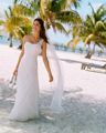 <p>Think about the setting and location of your wedding and try to choose a dress that fits in with the overall theme. if you're planning on a beach wedding, then a softer look or less structured style might go down better in Hawaii, rather than a traditional gown which would suit a church much better.</p>
<p><em>V3398, David's Bridal Collection, Soft White, £475.00, <a href="http://www.davidsbridal.co.uk" target="_blank">davidsbridal.co.uk</a></em><strong> </strong><strong></strong></p>