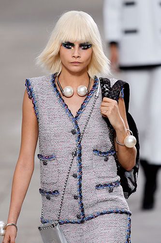 <p>Cara was representing the wig trend during Fashion Month, from Marc Jacobs to Fendi. We love this pretty-meets-punk wig that she rocked at the Chanel show in Paris earlier this month.</p>
<p><a href="http://www.cosmopolitan.co.uk/beauty-hair/news/styles/celebrity/cosmo-hairstyle-of-the-day" target="_blank">HAIRSTYLE OF THE DAY</a></p>
<p><a href="http://www.cosmopolitan.co.uk/beauty-hair/news/hairstyles/wig-hair-trend-2013-14" target="_blank">WHY WIGS ARE THE NEW HAIR TREND</a></p>
<p><a href="http://www.cosmopolitan.co.uk/beauty-hair/news/trends/celebrity-beauty/georgia-may-jagger-instagram-cara-delevingne" target="_blank">THE NEW WIG TREND AT FASHION WEEK</a></p>
