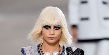 <p>Cara was representing the wig trend during Fashion Month, from Marc Jacobs to Fendi. We love this pretty-meets-punk wig that she rocked at the Chanel show in Paris earlier this month.</p>
<p><a href="http://www.cosmopolitan.co.uk/beauty-hair/news/styles/celebrity/cosmo-hairstyle-of-the-day" target="_blank">HAIRSTYLE OF THE DAY</a></p>
<p><a href="http://www.cosmopolitan.co.uk/beauty-hair/news/hairstyles/wig-hair-trend-2013-14" target="_blank">WHY WIGS ARE THE NEW HAIR TREND</a></p>
<p><a href="http://www.cosmopolitan.co.uk/beauty-hair/news/trends/celebrity-beauty/georgia-may-jagger-instagram-cara-delevingne" target="_blank">THE NEW WIG TREND AT FASHION WEEK</a></p>
