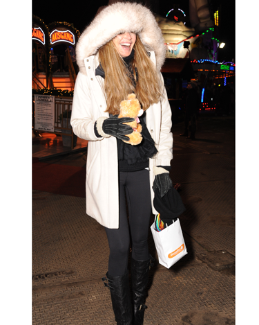 <p>Looking a bit like Brian Harvey in an E17 Christmas video, Elle models this season's must-have accessory: the tiny cuddly bear.</p>