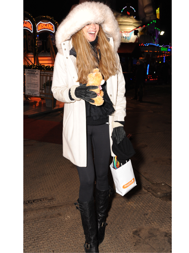 <p>Looking a bit like Brian Harvey in an E17 Christmas video, Elle models this season's must-have accessory: the tiny cuddly bear.</p>
