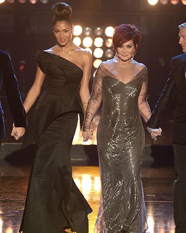 <p>For Saturday night's show, Sharon opted for a sheer-sleeved, metallic grey dress with a deep V at the front.</p>
<p>Nicole, meanwhile, wore her hair up in a giant topknot and an asymmetric black dress featuring origami style folds.</p>
<p>It's nice to see them both change things up, although we're not sure it's either of their best looks!</p>
<p><a href="http://www.cosmopolitan.co.uk/fashion/shopping/christmas-party-dress-2013-alternatives" target="_blank">PARTY WEAR BEYOND THE LBD</a></p>
<p><a href="http://www.cosmopolitan.co.uk/fashion/shopping/cheap-christmas-party-dresses" target="_blank">SHOP PARTY DRESSES FOR £25 OR LESS</a></p>
<p><a href="http://www.cosmopolitan.co.uk/fashion/shopping/christmas-party-best-flat-shoes" target="_blank">FABULOUS PARTY FLAT SHOES</a></p>