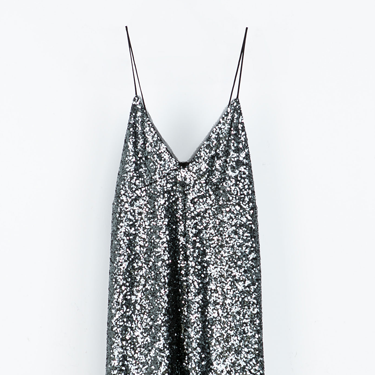 <p>"A sequin dress is a have must for the festive season. I love the delicate spaghetti straps and chiffon underlay of this Zara number. I'll be teaming it with a killer pair of heels for the perfect party look."</p>
<p><strong>Katie Saxon, Fashion Junior</strong></p>
<p>Sequin dress, £59.99, <a href="http://www.zara.com/uk/en/woman/dresses/sequinned-dress-c269185p1668838.html" target="_blank">zara.com</a></p>
<p><a href="http://www.cosmopolitan.co.uk/fashion/shopping/sequin-dress-black-gold" target="_blank">8 WAYS TO WEAR SEQUINS</a></p>
<p><a href="http://www.cosmopolitan.co.uk/fashion/shopping/primark-party-wear-dresses" target="_blank">PRIMARK'S PARTY PIEVCES ARE AMAZING</a></p>
<p><a href="http://www.cosmopolitan.co.uk/fashion/shopping/womens-clothing-under-ten-pounds" target="_blank">DAILY FASHION BUY FOR £10 OR LESS</a></p>