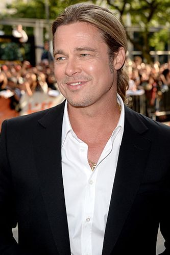 <p>Brad turned up in Toronto, Canada for the Toronto International Film Fest premiere of 12 Years A Slave, which he executive produced. While the film was appropriately praised by critics, we're still finding it a tad difficult to tear our attention away from Brad's handsome suit, sexy smirk, and man-ponytail. Swoon.</p>