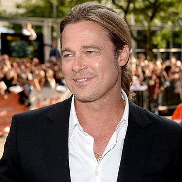 <p>Brad turned up in Toronto, Canada for the Toronto International Film Fest premiere of 12 Years A Slave, which he executive produced. While the film was appropriately praised by critics, we're still finding it a tad difficult to tear our attention away from Brad's handsome suit, sexy smirk, and man-ponytail. Swoon.</p>