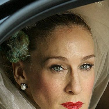 <p>Sarah Jessica Parker is probably the only person who could make us think wearing a bird in our hair to get married is the best idea ever. Also, we love her red lippie for real movie star style.</p>
<p><a href="http://www.cosmopolitan.co.uk/fashion/news/kaley-cuoco-wedding-dress" target="_blank">KALEY CUOCO'S PINK WEDDING DRESS</a></p>
<p><a href="http://www.cosmopolitan.co.uk/beauty-hair/news/trends/celebrity-beauty/best-wedding-makeup-tips-celebrity-makeup?click=main_sr" target="_blank">WEDDING MAKEUP WE WANT TO COPY</a></p>
<p><a href="http://www.cosmopolitan.co.uk/fashion/shopping/top-ten-wedding-dresses-on-film?click=main_sr" target="_blank">TOP TEN WEDDING DRESSES ON FILM</a></p>