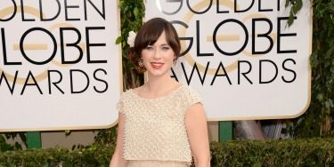 <p>Zooey Deschanel has gone for a soft, romantic look in this floaty Oscar de la Renta dress. We love her low chignon complete with white rose. Beautiful!</p>
<p><a href="http://www.cosmopolitan.co.uk/beauty-hair/news/trends/celebrity-beauty/best-golden-globes-hair-makeup-beauty" target="_blank">BEST GOLDEN GLOBES BEAUTY EVER</a></p>
<p><a href="http://www.cosmopolitan.co.uk/fashion/celebrity/best-golden-globes-dresses-ever" target="_blank">REMEMBER THESE GOLDEN GLOBES DRESSES?</a></p>
<p><a href="http://www.cosmopolitan.co.uk/fashion/celebrity/best-dressed-celebrities-10-january" target="_blank">THIS WEEK'S BEST DRESSED CELEBRITIES</a></p>