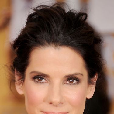 <p>Sandra does barefaced beauty so well. With no earrings or necklace to compete with, she simply glowed with beautiful skin and flushed cheeks. Her messy bun was another picture of perfection.</p>
<p><a href="http://www.cosmopolitan.co.uk/beauty-hair/news/trends/celebrity-beauty/golden-globes-2014-hair-makeup-looks" target="_self">GOLDEN GLOBES BEST BEAUTY LOOKS</a></p>
<p><a href="http://www.cosmopolitan.co.uk/beauty-hair/news/styles/celebrity/cosmo-hairstyle-of-the-day" target="_self">COSMO'S HAIRSTYLE OF THE DAY</a></p>
<p><a href="http://www.cosmopolitan.co.uk/beauty-hair/news/styles/hair-trends-spring-summer-2014" target="_self">HUGE HAIR TRENDS FOR 2014</a></p>