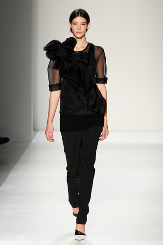 <p>Lesson in making an all-black ensemble more interesting: Use of sheer sleeves and a bloody great big corsage thingy.</p>
<p><a href="http://www.cosmopolitan.co.uk/fashion/Fashion-week/fashion-week-daily-live-streams" target="_blank">WATCH NEW YORK FASHION WEEK LIVE (FROM YOUR SOFA)</a></p>
<p><a href="http://cosmopolitan.co.uk/fashion/news/victoria-beckham-fashion-skype-documentary?click=main_sr" target="_blank">GO BEHIND-THE-SCENES AT VB'S FASHION LABEL HQ</a></p>
<p><a href="http://www.cosmopolitan.co.uk/fashion/shopping/dress-spring-fashion-trends-2014" target="_blank">SHOP 12 DRESSES THAT SCREAM SPRING</a></p>
<p> </p>