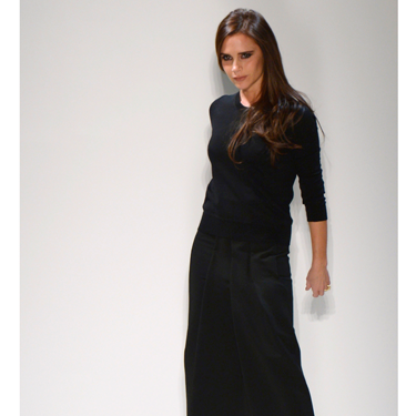 <p>Victoria Beckham brought her Autumn/Winter 2014 collection to New York Fashion Week (with David and their too-cute kids watching from the frow), and showed how far she's come as a <em>bona fide</em> fashion designer.</p>
<p>Showing looser silhouettes - but still with her trademark structure - the collection included pleated dresses and skirts, oversized coats, sleeveless jackets, slouchy trousers and - get this! - flat shoes. We know right? We told you VB's signature style has relaxed somewhat.</p>
<p>With a colour palette consisting of mainly monochrome there were still plenty of surprises like punchy pops of red and gold chain details.</p>
<p>"I like the element of surprise that you get with something that seems strict from the front but has a cut-away or soft, blouson back," said VB backstage.</p>
<p>Her AW14 collection went down a storm with the assembled fash pack - though we were a tad disappointed when Victoria disn't come out and point, Spice Girl-style. Oh well, there's always next season...</p>
<p><strong>CLICK THROUGH TO SEE CATWALK PICTURES >>></strong></p>
<p> </p>