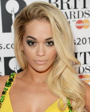 <p>Rita revved up the glamour with her hair full of volume and swept to one side. Her winged aquatic eye makeup looked beautiful against her bejewelled yellow dress.</p>
<p><a href="http://www.cosmopolitan.co.uk/fashion/news/brits-red-carpet-2014" target="_blank">NOW SEE THE BRITS CELEBRITY DRESSES</a></p>
<p><a href="http://www.cosmopolitan.co.uk/beauty-hair/news/styles/celebrity/celebrity-hairstyles-elle-awards-2014" target="_self">OR THE INCREDIBLE ELLE AWARDS HAIRSTYLES</a></p>
<p><a href="http://www.cosmopolitan.co.uk/beauty-hair/news/trends/celebrity-frow-hair-fashion-week" target="_self">AND THE FRONT ROW HAIR WE WANT</a></p>
<p><br /><br /></p>
