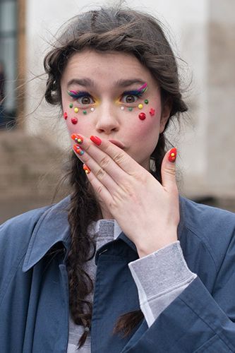 <p>Model Dasha Bilyuk was showcasing the Manish Arora catwalk style on the streets, and we liked what we see. Her multi-coloured makeup and matching nail art was young, fun and flirty. Nice to note that pigtail plaits are catching on too.</p>
<p><a href="http://www.cosmopolitan.co.uk/beauty-hair/news/trends/hair-makeup-trends-autumn-winter-2014" target="_self">BIG BEAUTY TRENDS FROM PARIS FASHION WEEK</a></p>
<p><a href="http://www.cosmopolitan.co.uk/beauty-hair/news/trends/celebrity-frow-hair-fashion-week" target="_self">FRONT ROW HAIRSTYLES - FASHION WEEK AW14</a></p>
<p><a href="http://www.cosmopolitan.co.uk/beauty-hair/news/trends/celebrity-beauty/celebrity-nail-art-manicures" target="_self">CELEBRITY NAIL ART MANICURE PICTURES</a></p>