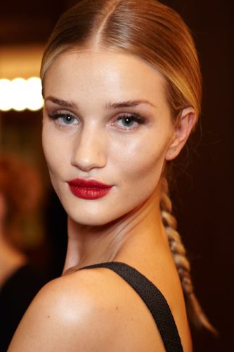 <p><strong>The look:</strong> Models Rosie Huntington-Whiteley (pictured) and Suki Waterhouse were given a Robert Palmer 'Addicted to Love' makeover by makeup artist Lisa Eldridge with seductive lashes and classic red lips. Hair stylist Eugene Souleiman continued the power glamour theme with "expensive-looking" hair of plaits leading from precise middle partings.</p>
<p><strong>The products:</strong> Eyes: Black Magic Mascara, Lash Wardrobe corner lashes, Brow Liner, Brow Gel - all Eyeko. Lips: Ruby Woo lipstick. Nails: Rougemarie nail polish. Both MAC.</p>