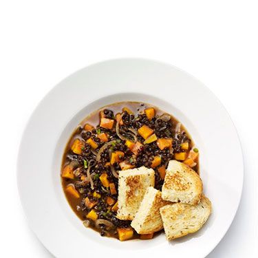 <p><strong>Quick lentil casserole with cheese croutons</strong></p>
<p>1. In a small flameproof casserole dish, soften 1 sliced red onion and 1 chopped carrot with 1tbsp oil over a medium heat. Add 1 chopped green chilli at the last minute.<br />2. Stir in 200ml vegetable stock, 1dsp tomato purée and season.<br />3. Bring to simmer, put the lid on and cook for 15 minutes. Stir in half the lentils and cook for 5 minutes.<br />4. Meanwhile, make the croutons. Sandwich two thinly-sliced pieces of bread with grated cheese. Fry in a little oil over a medium-high heat, turning over until both sides of the sandwich are golden.<br />5. Cut the crouton sandwich into four and serve with the casserole.</p>
<p><em>Optional extra: Add 1 tsp ground cumin with the chilli.</em></p>
<p> </p>
<p><a href="http://www.cosmopolitan.co.uk/diet-fitness/diets/healthy-eating-on-a-budget" target="_blank">EAT WELL FOR UNDER £15 SHOPPING LIST</a></p>
<p><a href="http://www.cosmopolitan.co.uk/diet-fitness/diets/comfort-food-recipes-under-300-calories" target="_blank">COMFORT FOOD UNDER 300 CALORIES</a></p>
<p><a href="http://www.cosmopolitan.co.uk/diet-fitness/diets/how-to-eat-healthy" target="_blank">7 STEPS TO A HEALTHIER LIFESTYLE</a></p>