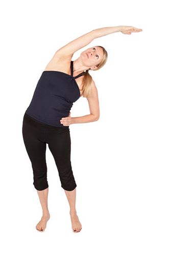 <p><strong>Warming up is vital because it allows the internal organs to relax, preparing your body for movement.</strong></p>
<p>Start by standing tall, with feet hip distance apart and parallel.</p>
<p>Inhale and stretch the arms up, exhale and lower the arms down - repeat five times</p>
<p>Stretch the right arm straight up over your head and bend from your waist to the left - return to centre</p>
<p>Stretch the left arm straight up and bend from your waist to the right - return to centre</p>
<p>Repeat the side bends 5 more times as this opens the sides of the body.</p>
<p>Rest hands behind you on your lower back to maintain length in the tailbone, draw the shoulder blades down, broaden the collar bones and extend the spine into a small back bend – hold for 5 breaths.<a href="http://www.cosmopolitan.co.uk/diet-fitness/fitness/at-home-workout-that-girl-charli-cohen-christina-howells" target="_blank"><em><br /><br /></em>THE BUSY GIRL'S WORKOUT</a></p>
<p><a href="http://www.cosmopolitan.co.uk/diet-fitness/fitness/the-benefits-of-pilates" target="_blank">WHY WE LOVE PILATES</a></p>
<p><a href="http://www.cosmopolitan.co.uk/diet-fitness/fitness/the-benefits-of-spinning" target="_blank">GET YOUR SPIN ON </a></p>