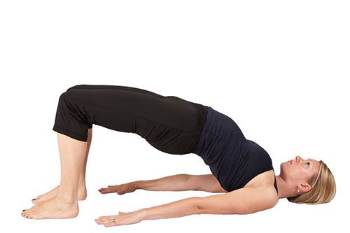 <p><strong>This move enhances organ function and eases cramps whilst mobilising and stretching out the spine.</strong></p>
<p>Lie down facing upwards with your knees bent and feet hip distance apart. Place your arms by your sides, palms down, and relax your shoulders.</p>
<p>Inhale to prepare, and as you exhale, slowly peel your spine off the mat one vertebra at a time, pressing your feet down to lift your hips.</p>
<p>Inhale as you pause at the top and exhale as you lower your spine to return to the mat - repeat 5 times.<a href="http://www.cosmopolitan.co.uk/diet-fitness/fitness/at-home-workout-that-girl-charli-cohen-christina-howells" target="_blank"><em><br /><br /></em>THE BUSY GIRL'S WORKOUT</a></p>
<p><a href="http://www.cosmopolitan.co.uk/diet-fitness/fitness/the-benefits-of-pilates" target="_blank">WHY WE LOVE PILATES</a></p>
<p><a href="http://www.cosmopolitan.co.uk/diet-fitness/fitness/the-benefits-of-spinning" target="_blank">GET YOUR SPIN ON </a></p>