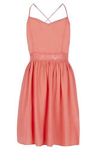<p>This flippy, flirty frock has a striking cross-back detail and the coral colour will look amazing against a tan. That is, if we get some sunshine.</p>
<p>Coral cross-back dress, £17.99, <a href="http://www.newlook.com/shop/womens/dresses/coral-strappy-cross-back-crochet-waist-skater-dress_306366883?isRecent=true" target="_blank">NewLook.com</a></p>
<p><a href="http://www.cosmopolitan.co.uk/fashion/shopping/how-to-style-the-midi-skirt-trend-top-tips" target="_blank">10 WAYS TO STYLE THE MIDI SKIRT</a></p>
<p><a href="http://www.cosmopolitan.co.uk/fashion/shopping/Kate-Moss-Topshop-collection-spring-summer-2014-best-pieces" target="_blank">KATE MOSS FOR TOPSHOP: THE EDIT</a></p>
<p><a href="http://www.cosmopolitan.co.uk/fashion/shopping/how-to-wear-boyfriend-jeans" target="_blank">BOYFRIEND JEANS: THE NEED-TO-KNOW</a></p>