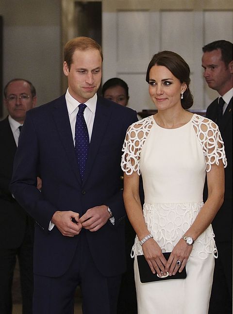 The Duchess looks stunning in a white cocktail dress by Lela Rose. The lace trim gown features a striking peplum detail at the waist.<p><strong>MORE ROYAL SHENANIGANS:</strong></p><p><a href="http://www.cosmopolitan.co.uk/fashion/kate-middletons-royal-style-109645?click=main_sr" target="_blank">KATE MIDDLETON'S ROYAL STYLE CV</a></p><p><a href="http://www.cosmopolitan.co.uk/celebs/celebrity-gossip/kate-middleton-prince-william-george-photo?click=main_sr" target="_blank">BABY GEORGE'S FIRST OFFICIAL PIC</a></p><p><a href="http://www.cosmopolitan.co.uk/love-sex/cosmo-centerfolds/prince-harry-william-lookalikes-naked-centrefolds?click=main_sr" target="_blank">THE PRINCES STRIP FOR COSMO</a></p>