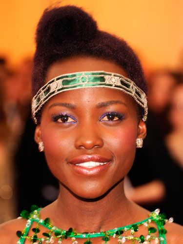 Lupita didn’t disappoint with her emerald flapper girl headband and amethyst eye makeup. The retro pompadour roll, styled to the side, was equally artistic.<p><a href="http://www.cosmopolitan.co.uk/fashion/news/kendall-jenner-wears-topshop-to-met-ball-gala" target="_blank">KENDALL JENNER WEARS TOPSHOP AT THE MET BALL</a></p>
<p><a href="http://www.cosmopolitan.co.uk/fashion/news/met-gala-2014-red-carpet-dresses" target="_blank">THE FULL MET BALL 2014 RED CARPET</a></p>
<p><a href="http://www.cosmopolitan.co.uk/celebs/celebrity-gossip/10-favourite-met-ball-instagrams" target="_blank">BEHIND THE SCENES OF THE MET BALL IN CELEBRITY INSTAGRAMS</a></p>