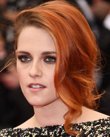 <p>Kristen's new(ish) orange hair looked gorgeous in a side-parted fishtail plait. While her hair was girlie, her makeup was grunge; featuring a wet-look smoky eye.</p>
<p><a href="http://www.cosmopolitan.co.uk/fashion/news/kendall-jenner-wears-topshop-to-met-ball-gala" target="_blank">KENDALL JENNER WEARS TOPSHOP AT THE MET BALL</a></p>
<p><a href="http://www.cosmopolitan.co.uk/fashion/news/met-gala-2014-red-carpet-dresses" target="_blank">THE FULL MET BALL 2014 RED CARPET</a></p>
<p><a href="http://www.cosmopolitan.co.uk/celebs/celebrity-gossip/10-favourite-met-ball-instagrams" target="_blank">BEHIND THE SCENES OF THE MET BALL IN CELEBRITY INSTAGRAMS</a></p>