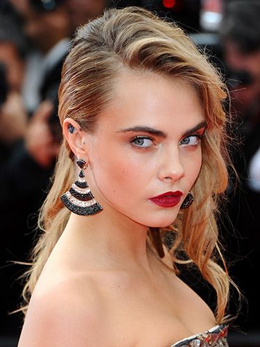 <p>Cara's become accustomed to her side-swept hairstyle and red lip combo for a fancy event and we can see why. This part-edgy, part-power glamour look is HOT on the model and made for our fave look at The Search premiere.</p>
<p><a href="http://www.cosmopolitan.co.uk/beauty-hair/news/styles/celebrity/cannes-choppard-party-wedding-hair-ideas" target="_blank">INSANELY GOOD WEDDING HAIR INSPO AT CANNES</a></p>
<p><a href="http://www.cosmopolitan.co.uk/beauty-hair/news/trends/celebrity-beauty/millie-mackintosh-tv-baftas-hair-makeup" target="_self">THE HOTTEST HAIRSTYLES AT THE BAFTAS</a></p>
<p><a href="http://www.cosmopolitan.co.uk/beauty-hair/news/styles/celebrity/ellie-goulding-hair-cut-long-bob" target="_blank">ELLIE GOULDING'S COOL NEW LONG BOB</a></p>