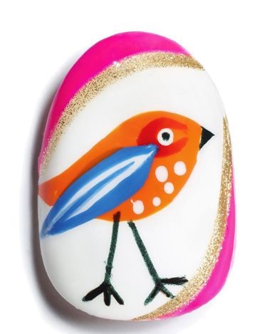 <p><strong>Using Max factor Glossfinity </strong></p>
<p><strong>1.</strong> Paint the entire nail with a white base.</p>
<p><strong>2.</strong> When dry, use a bright orange polish to paint a teardrop shape for the bird's body.</p>
<p><strong>3.</strong> When dry, create a red 'C' shape for the base of the eye and an overlapping blue wing. You might want to invest in a small nail art brush for these details.</p>
<p><strong>4.</strong> When dry, use a white polish and striping brush to add detail to the wing, and use a dotter to dot the eye and breast of the bird.</p>
<p><strong>5.</strong> Use a black polish and striping brush to draw the legs and beak, and a dotter to dot the eye.</p>
<p><strong>6.</strong> Frame the outer edges of the nail with a pink and glitter polish using a striper brush.</p>