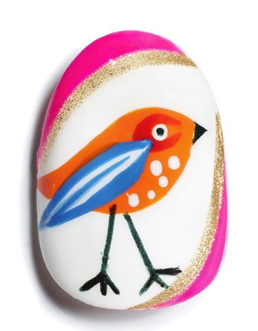 <p><strong>Using Max factor Glossfinity </strong></p>
<p><strong>1.</strong> Paint the entire nail with a white base.</p>
<p><strong>2.</strong> When dry, use a bright orange polish to paint a teardrop shape for the bird's body.</p>
<p><strong>3.</strong> When dry, create a red 'C' shape for the base of the eye and an overlapping blue wing. You might want to invest in a small nail art brush for these details.</p>
<p><strong>4.</strong> When dry, use a white polish and striping brush to add detail to the wing, and use a dotter to dot the eye and breast of the bird.</p>
<p><strong>5.</strong> Use a black polish and striping brush to draw the legs and beak, and a dotter to dot the eye.</p>
<p><strong>6.</strong> Frame the outer edges of the nail with a pink and glitter polish using a striper brush.</p>