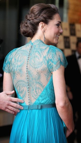 Stepping out with Will for the Olympics concert, Kate wore this gorgeous teal Jenny Packham dress with an intricate lace back. Almost exactly a year on from her wedding where she wowed in lacy Alexander McQueen, it seems like Kate knows what works for her whether she's dressing for her own wedding or a glamorous red carpet event.