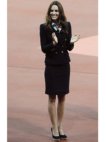 <p>Kate Middleton channels air stewardess chic as she hands out medals at the Olympic Stadium during the Paralympics.</p>
<p>The Duchess wore a patterned Team GB scarf and a navy blazer teamed with a navy pencil skirt and her favourite Stuart Weitzman wedges.</p>
<p>Hmm, we wonder whether she directed people to the nearest safety exits while she was there?</p>