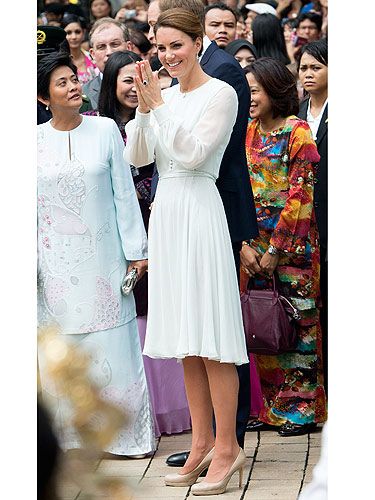 Kate Middleton continued on with her pastel silk trend, this time wearing Beulah London at another cultural event in Malaysia for the Diamont Jubilee tour. She looked royally prim and proper pulled her hair back in a low bun and her favourite nude LK Bennett pumps standing next to Prince William. Didn't they look smashing?