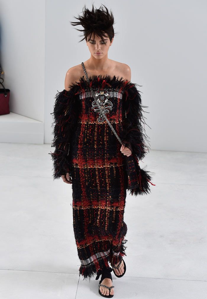 <p>Over on the runway, Kendall made her Chanel couture catwalk debut in incredible style.</p>
<p>The Keeping Up With The Kardashians star - and now bonafide high fashion model - wore a dark red and black knit dress with feathers sprouting from her sleeves.</p>
<p><a href="http://www.cosmopolitan.co.uk/fashion/news/paris-fashion-week-celebrities" target="_blank">ALL THE FRONT ROW FASHION FROM PARIS</a></p>
<p><a href="http://www.cosmopolitan.co.uk/fashion/news/paris-fashion-week-versace" target="_blank">J.LO WOWS IN WHITE AT VERSACE</a></p>