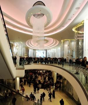 People, Ceiling, Interior design, Light fixture, Lighting accessory, Shopping mall, Interior design, Retail, Ceiling fixture, Hall, 