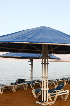 Outdoor table, Outdoor furniture, Shade, Sea, Beach, Resort, Outdoor structure, 