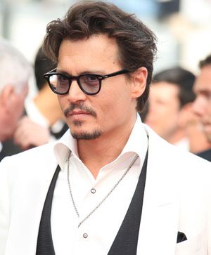 Johnny Depp says photo shoots make him feel raped