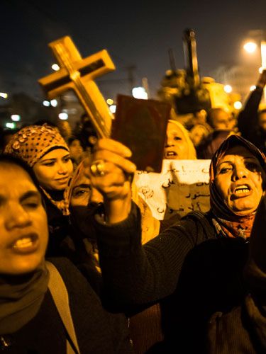 Egyptian protesters chant slogans during a demonstration