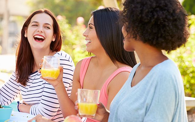 Smile, Drink, Jheri curl, Happy, Tableware, Juice, Facial expression, Summer, Wine glass, Interaction, 