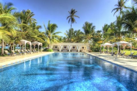 Swimming pool, Property, Resort, Arecales, Real estate, Woody plant, Azure, Tropics, Reflection, Resort town, 
