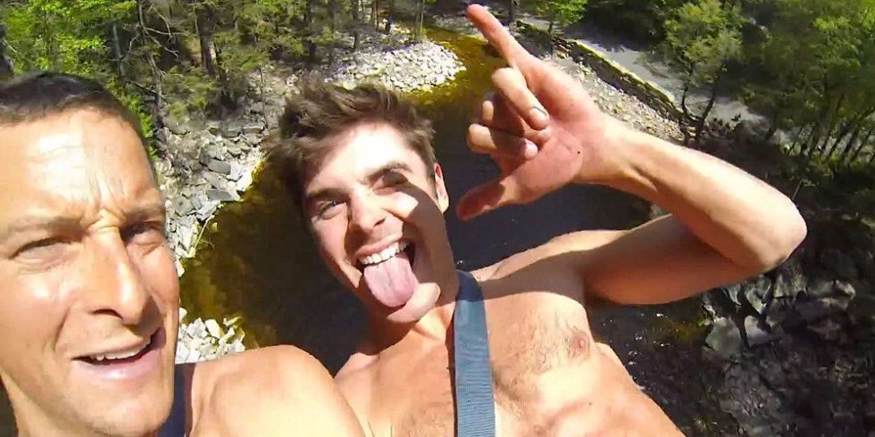 Shirtless Zac Efron Scales A Cliff In New Teaser Video For