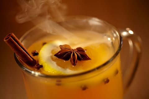 Hot toddy drink with chocolate flake and lemon