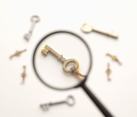 Keys under a magnifying glass