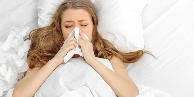 Woman feeling ill with flu