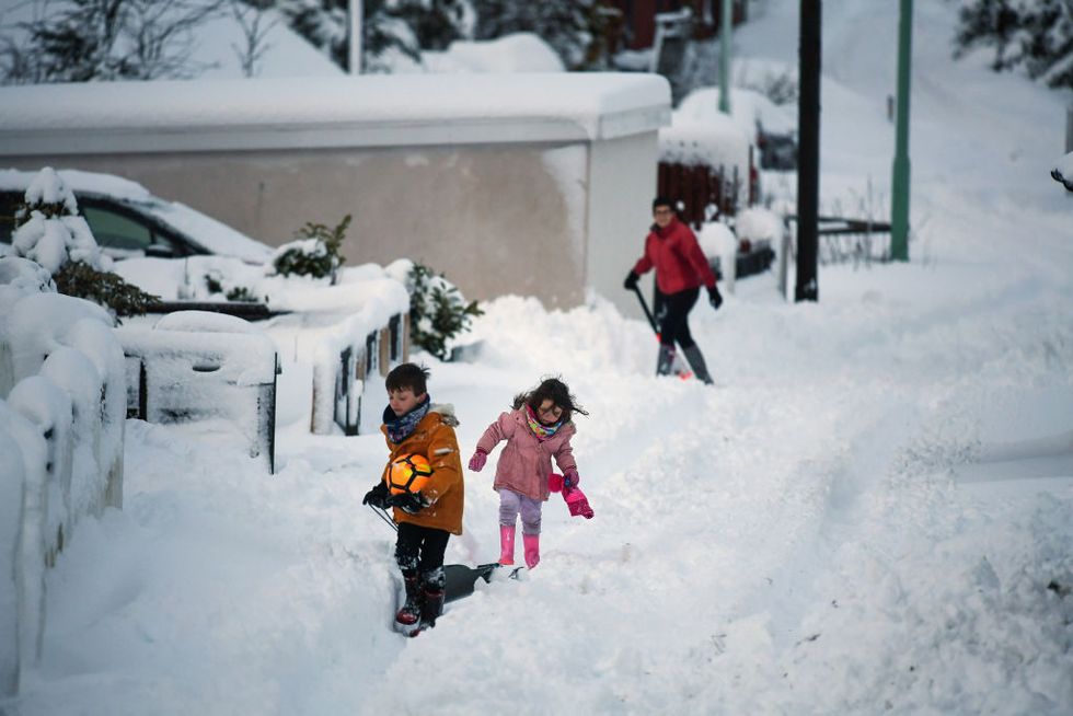children sledge snow in scotland