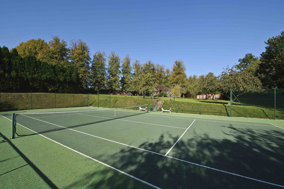 Adele - Lock House - West Sussex - tennis court - Strutt and Parker